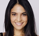 The Freeman Studio A woman with straight black hair and a light complexion smiles at the camera against a plain background. New York & Toronto Acting Studio