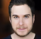 The Freeman Studio A man with short dark hair, light skin, and a trimmed beard looks directly at the camera with a neutral expression. New York & Toronto Acting Studio